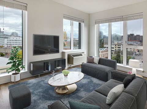 a living room with a couch and a coffee table and a television